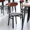 image:imageFlash Furniture Wright Commercial Dining Chair  Walnut Finish Wood Boomerang Back  Black Vinyl Seat  500 LB Capacity Black Steel Frame  Integrated FootrestWalnut Wood BackGray Vinyl Seat