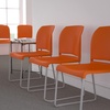 image:imageFlash Furniture HERCULES Series 880 lb Capacity Gray Full Back Contoured Stack Chair with Black Powder Coated Sled BaseOrange